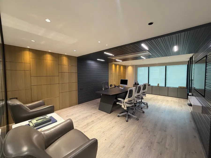 Executive cabin with meeting desk inside the Stone Hill office in Manikonda