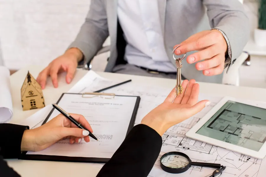 A property sale agreement being signed