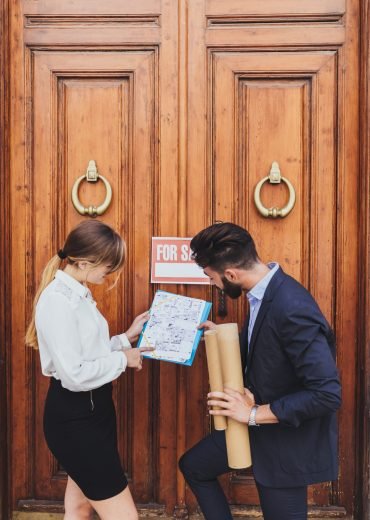 real-estate-agent-architect-exminating-plans real-estate-agent-architect-exminating-plans